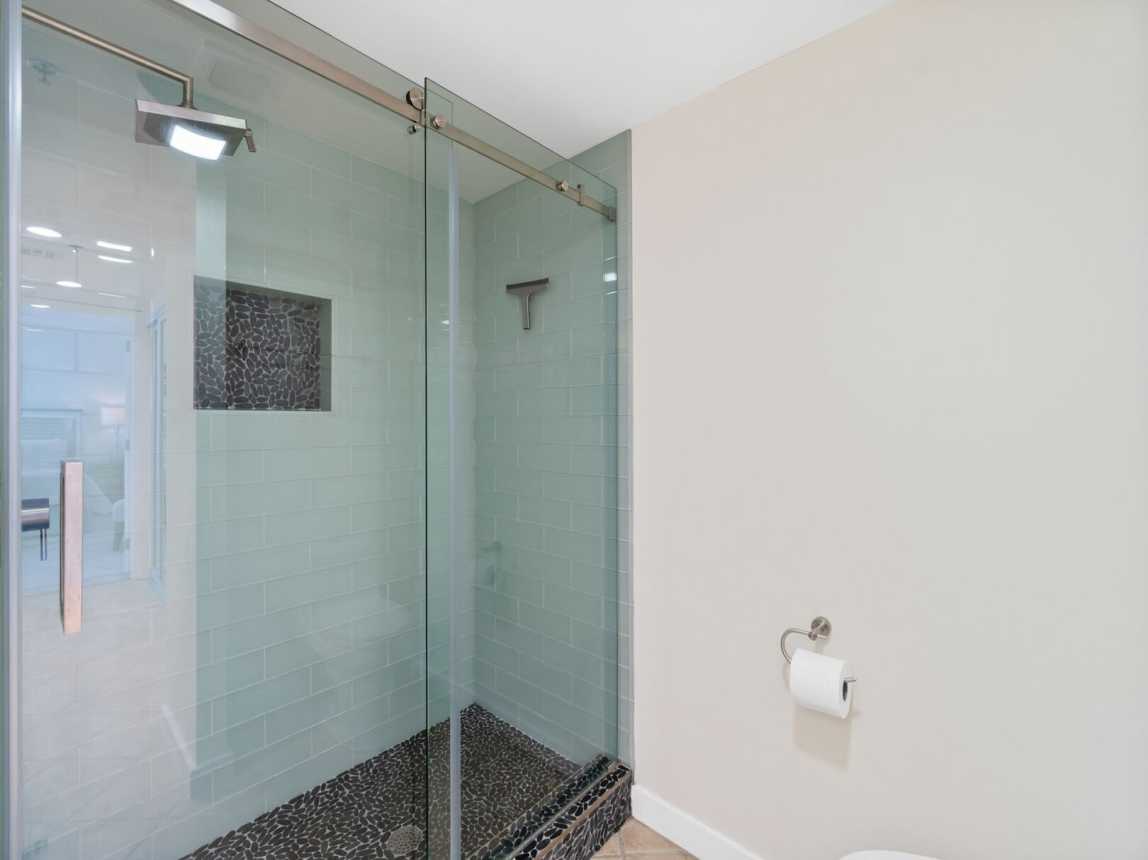 Ensuite very large step in shower with a nice built in shelf to set all your bath essentials.