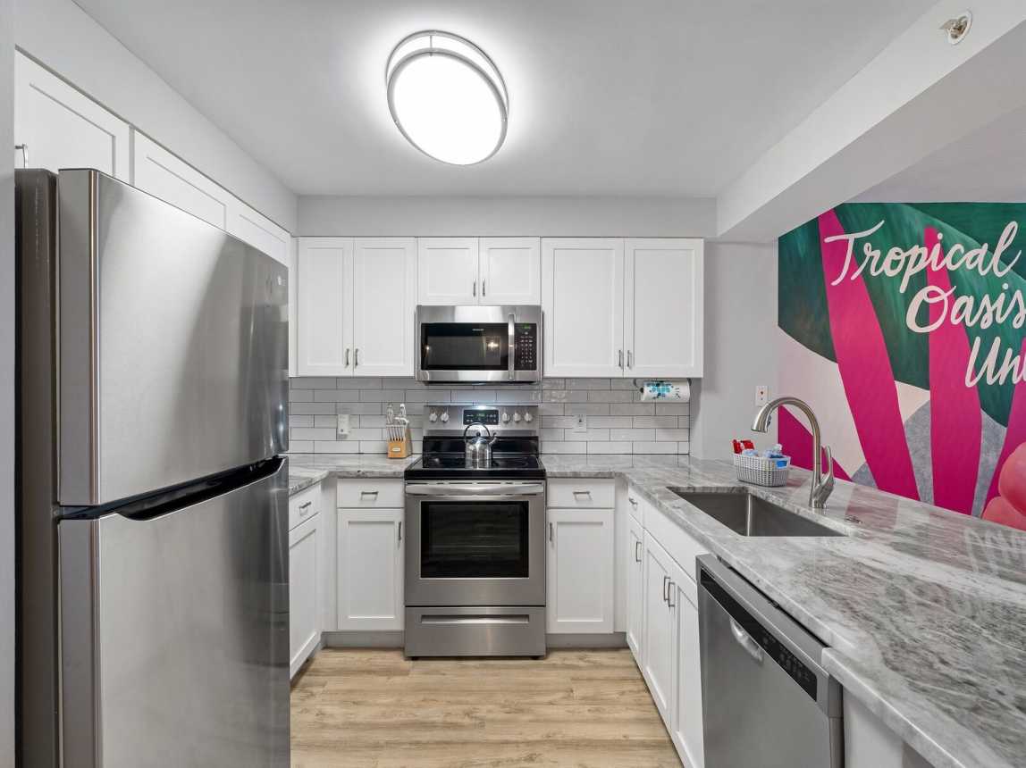 All brand new kitchen with updated appliances, granite counter space and full size refrigerator. Fully stocked with bakeware, cookware, dinnerware, etc. for your convenient use.