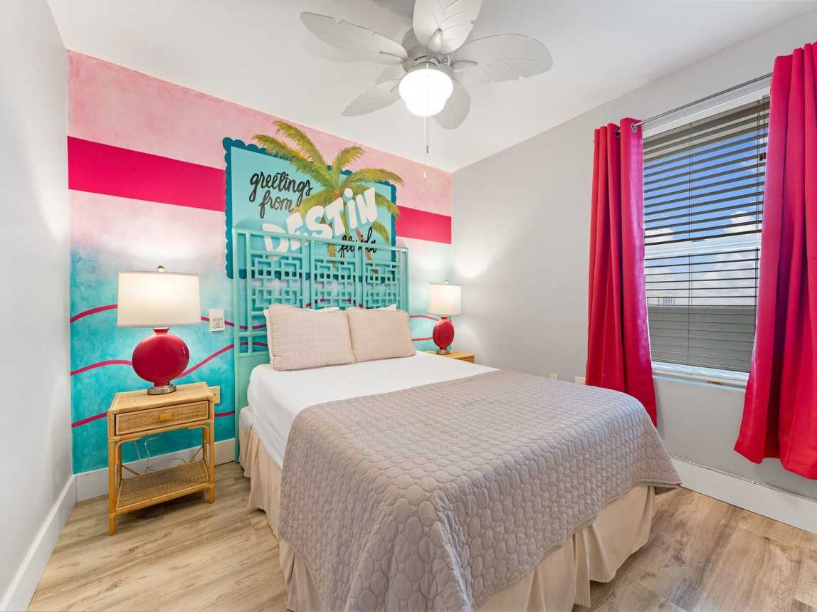 Guest room offers a queen size bed with lush mattress and fluffy pillows, and fresh crisp linen for a good night of rest after a day at the beach.