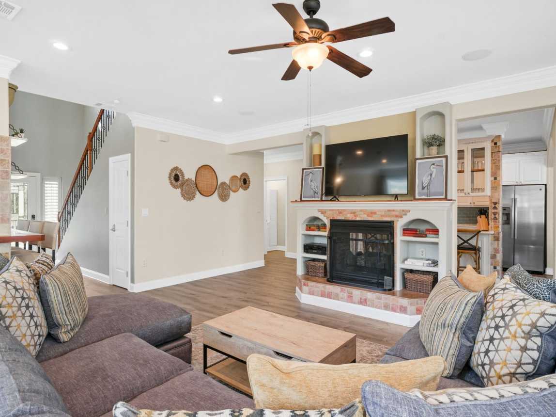 Showing livingroom view of large screen TV w/cable and fireplace.