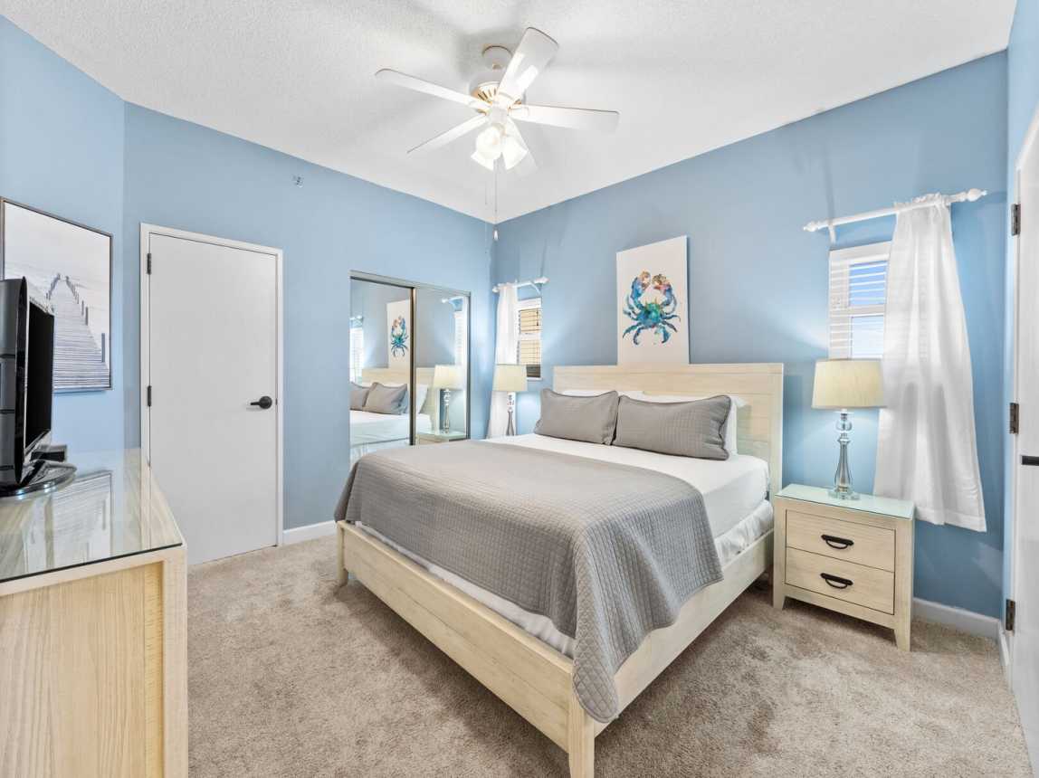 The master suite is a comfortable retreat after a day of beach activities.  Sink into the plush king size bed with crisp while linens and soft pillows and get ready for a great night's sleep. There are 2 bedside tables & lamps. A double size closet and a 