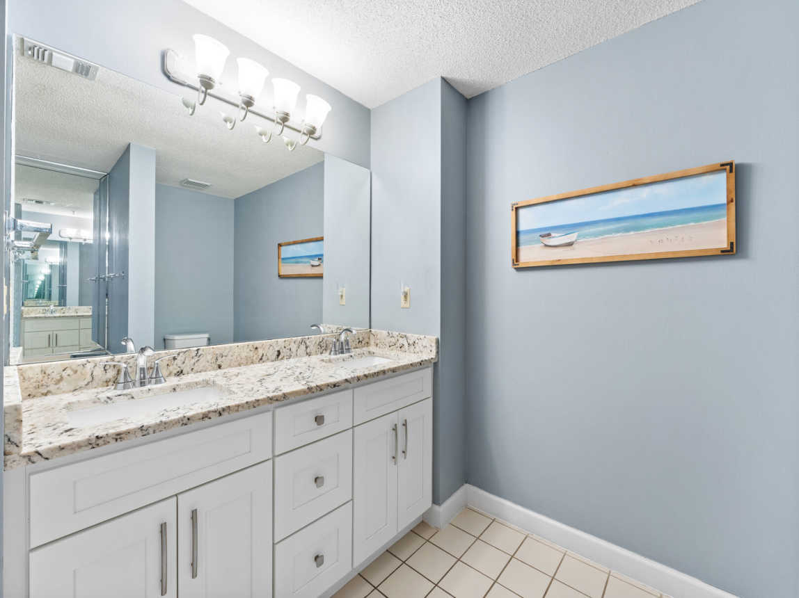 Two sink vanity, full mirror and plenty of counter and storage space.