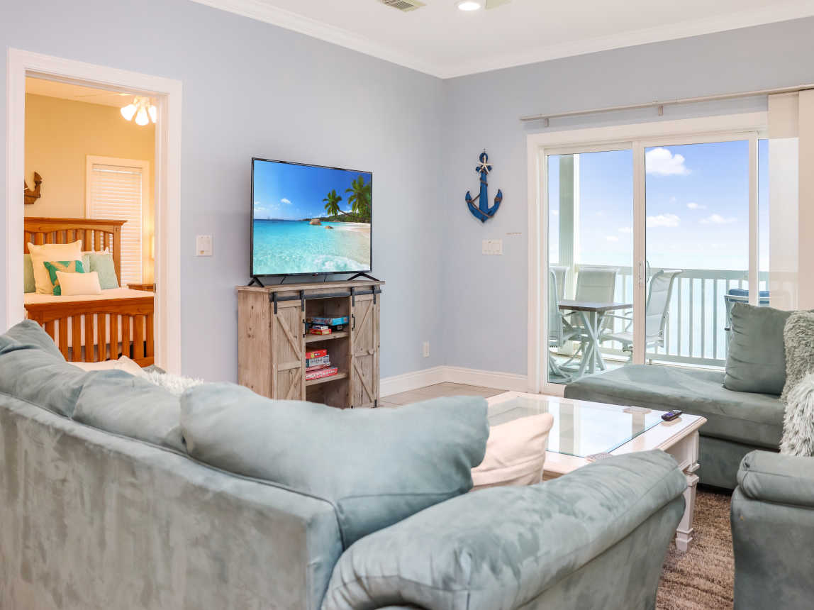 Beachfront Living Room with TV and View of Bedroom 3