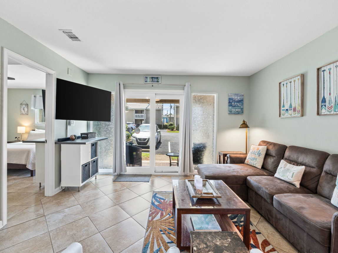 Welcome to Chateau LeMar. A pet friendly property. View of living room from the dining room and kitchen. Walk out to patio. Comfortable sofa with lounder at one end for a quick snooze.