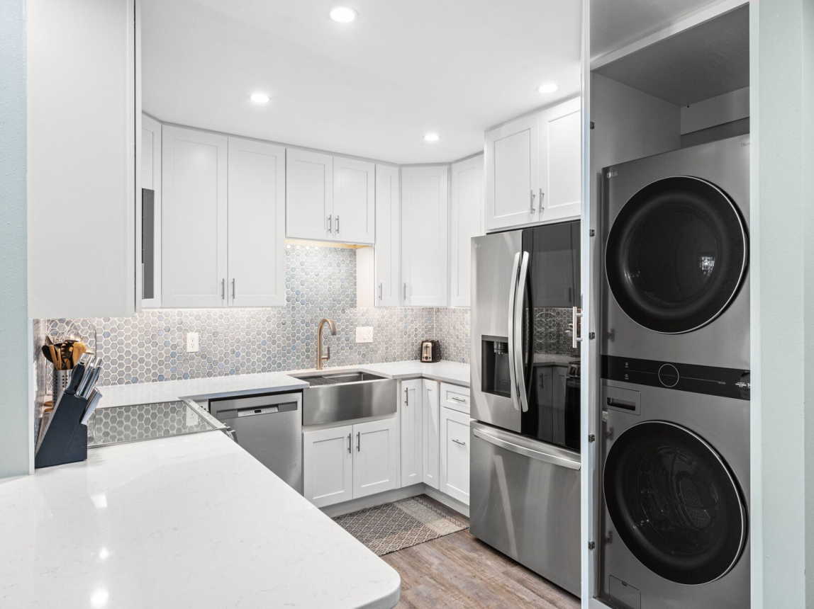 Totally remodeled kitchen with all new cabinets, counter top, backsplash and appliances. Unique see thru door of regrigerator, new full size washer and dryer.