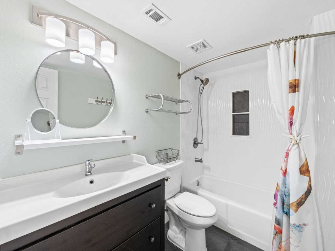 Masterbath offers tub/shower combo large vanity with mirror and hand held shower. Bathroom had been totaly remodeled.
