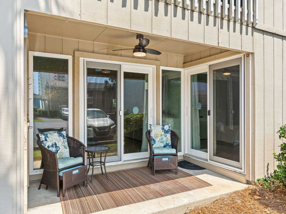 Back patio with comfortable wicker/footstool seating with entry from living room and master suite. Enjoy an early morning cup of coffee or an evening beverage while taking in all that fresh gulf air and sunshine.