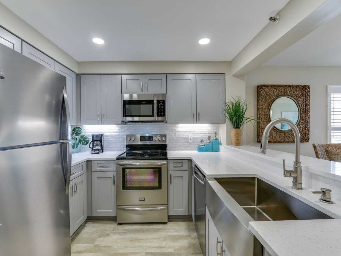 Kitchen has been fully remodeled and includes stainless steel appliances.
