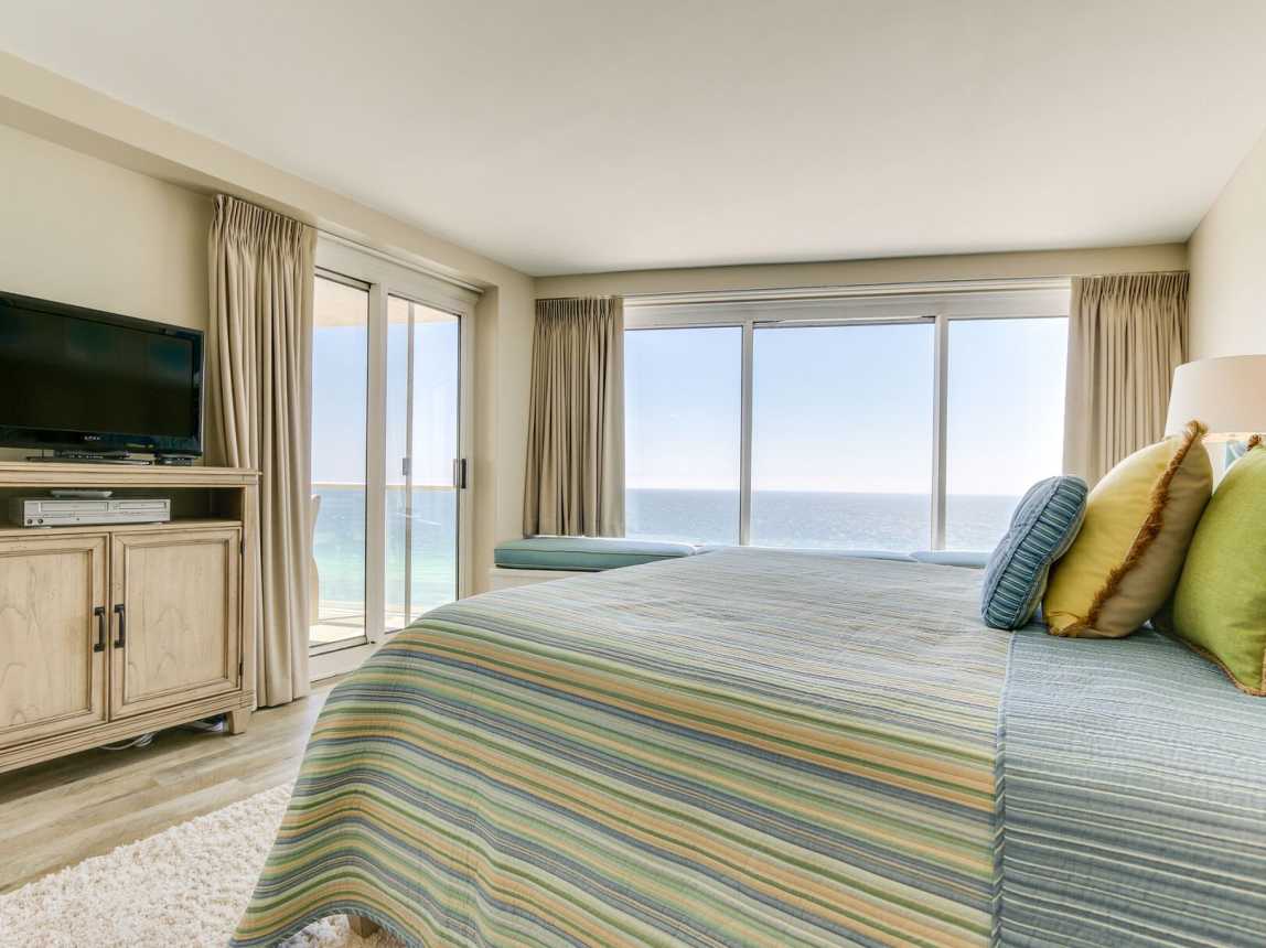 Beautiful master bedroom has its own access to the  beachfront balcony. Flat screen TV w/cable.