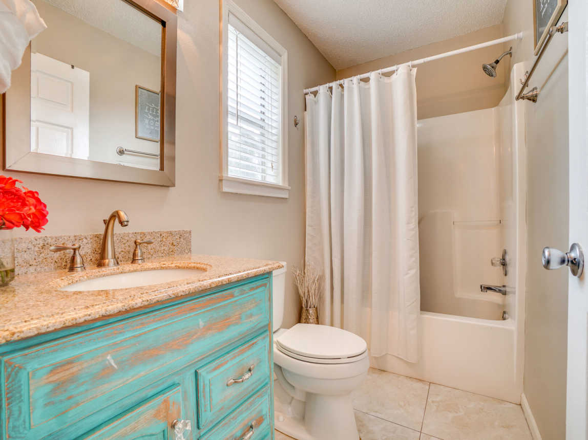 Guest bath provides you with a walk in shower, vanity, mirror and bath linens.