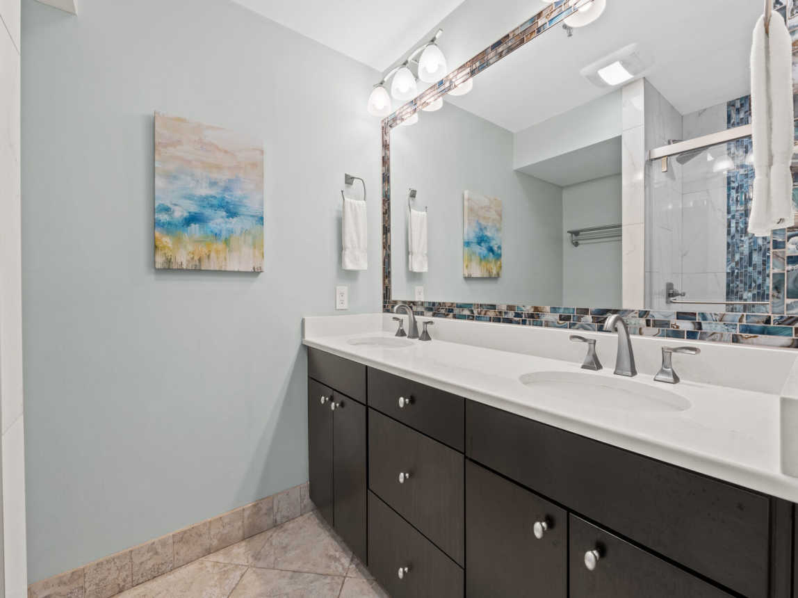 Master bath provides a roomy double sink with full length mirror, and plenty of drawer and cabinet space.