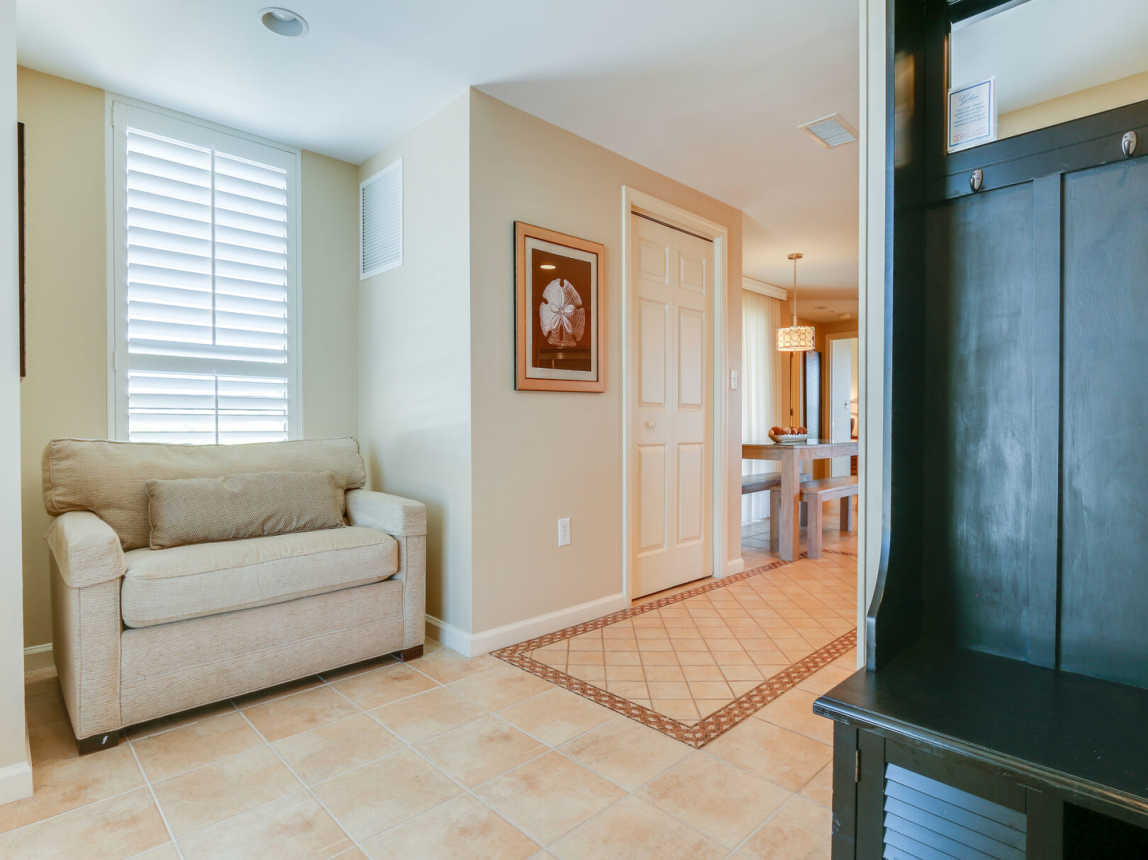 As you enter the property there is a single size pull out bed for extra overnight guest. Linen provided. Enter the hallway to the kitchen.