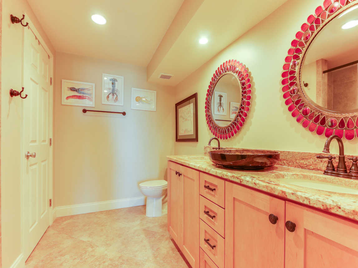 Enjoy the rich tones of the master bath with double vanity and mirrors. Plenty of Storage for all the bathroom needs. Walk in shower on left.