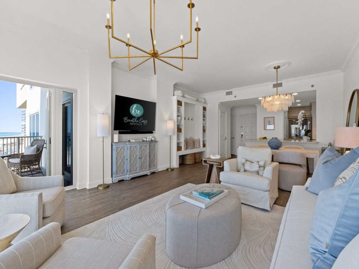 The spacious living room comfortably seats 5, featuring a smart TV and an open layout perfect for chatting while cooking! ---