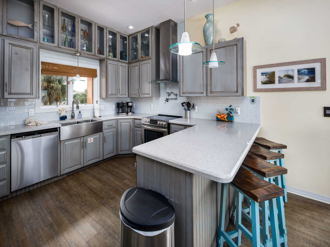 Fully stocked kitchen with breakfast bar