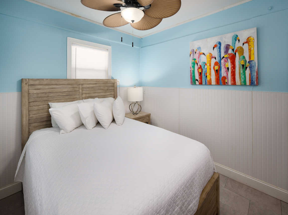 First floor guest bedroom with queen size bed