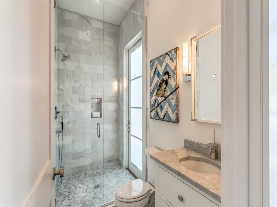 1st Floor Guest Bathroom - Featuring a Single Vanity & Walk In Shower