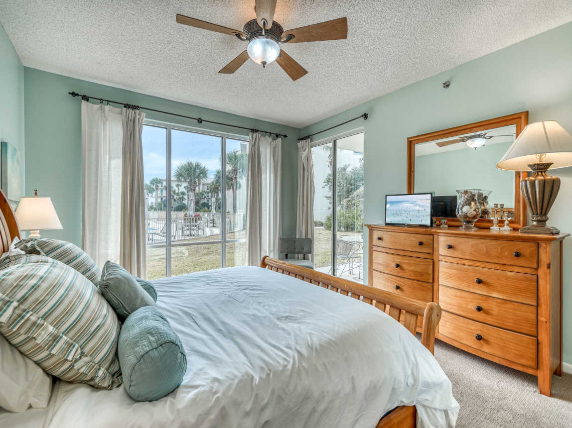 Primary King Suite - Patio Access & Flat-Screen TV