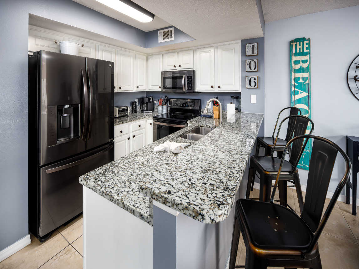 Fully stocked kitchen with breakfast bar