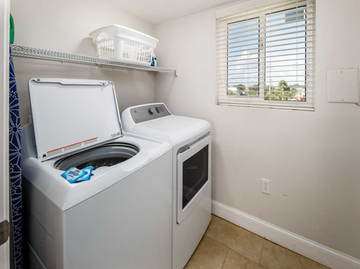 Laundry room with full size washer and dryer