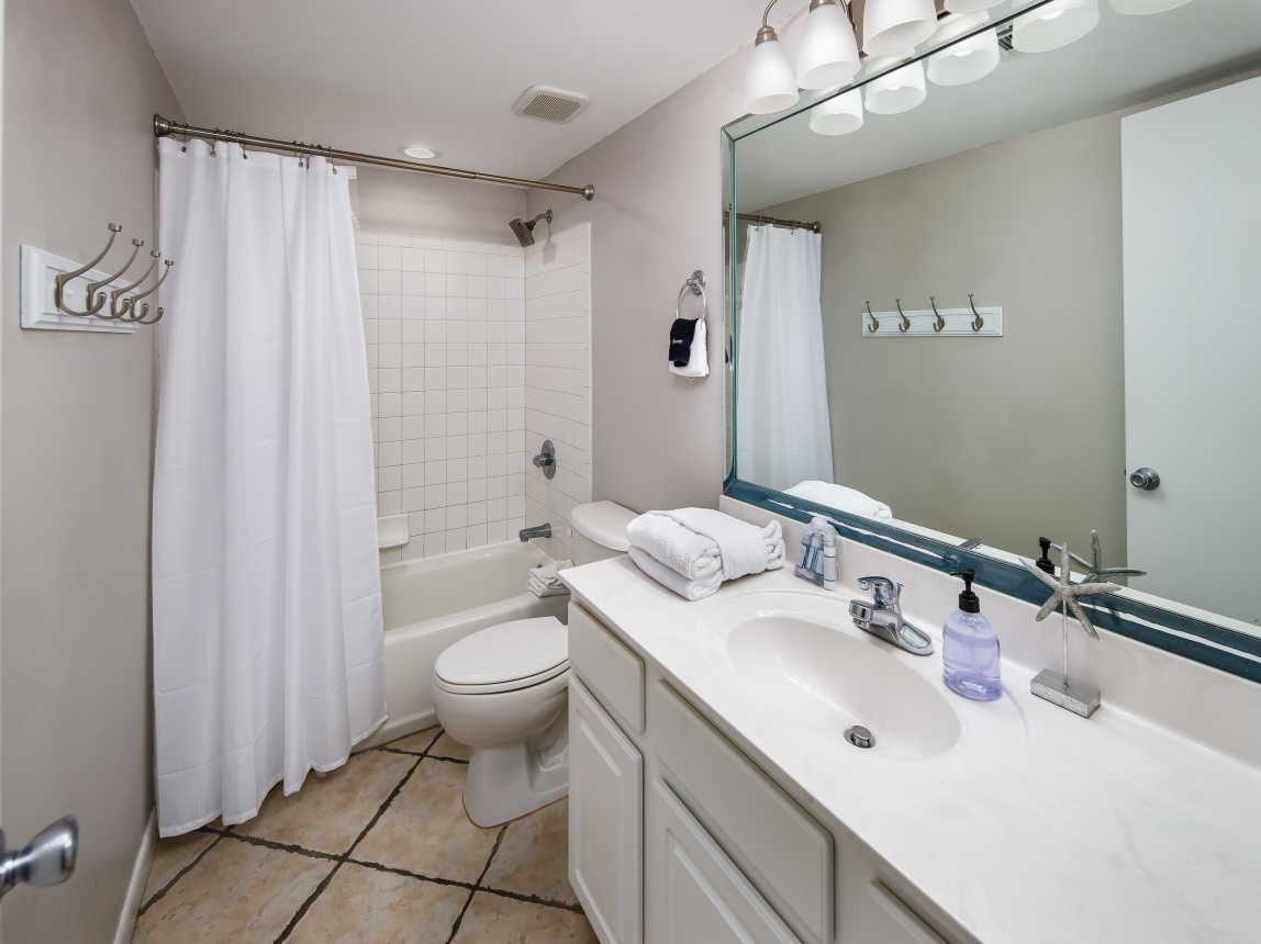 Second full size bathroom with shower/tub combo