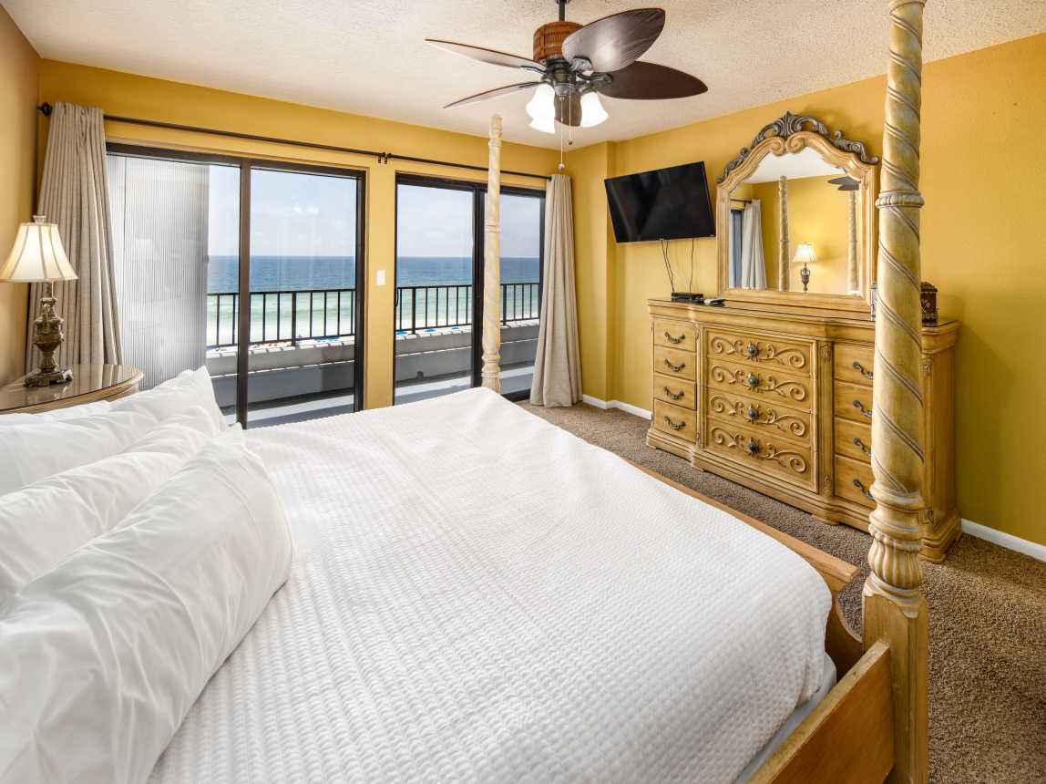 Master bedroom with TV and private bathroom