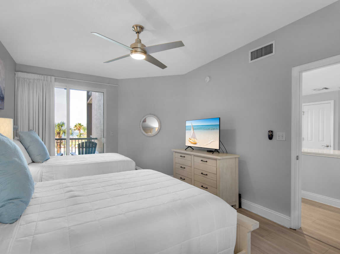 TV and Private Patio Access in Bedroom 2