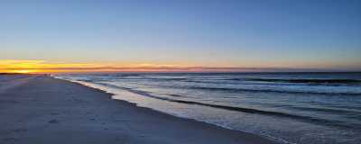 Enjoy the sunrise while listening to the sound of the waves while walking on the white sands of bama