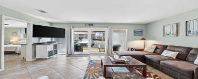 Welcome to Chateau LeMar. A pet friendly property. View of living room from the dining room and kitchen. Walk out to patio. Comfortable sofa with lounder at one end for a quick snooze.