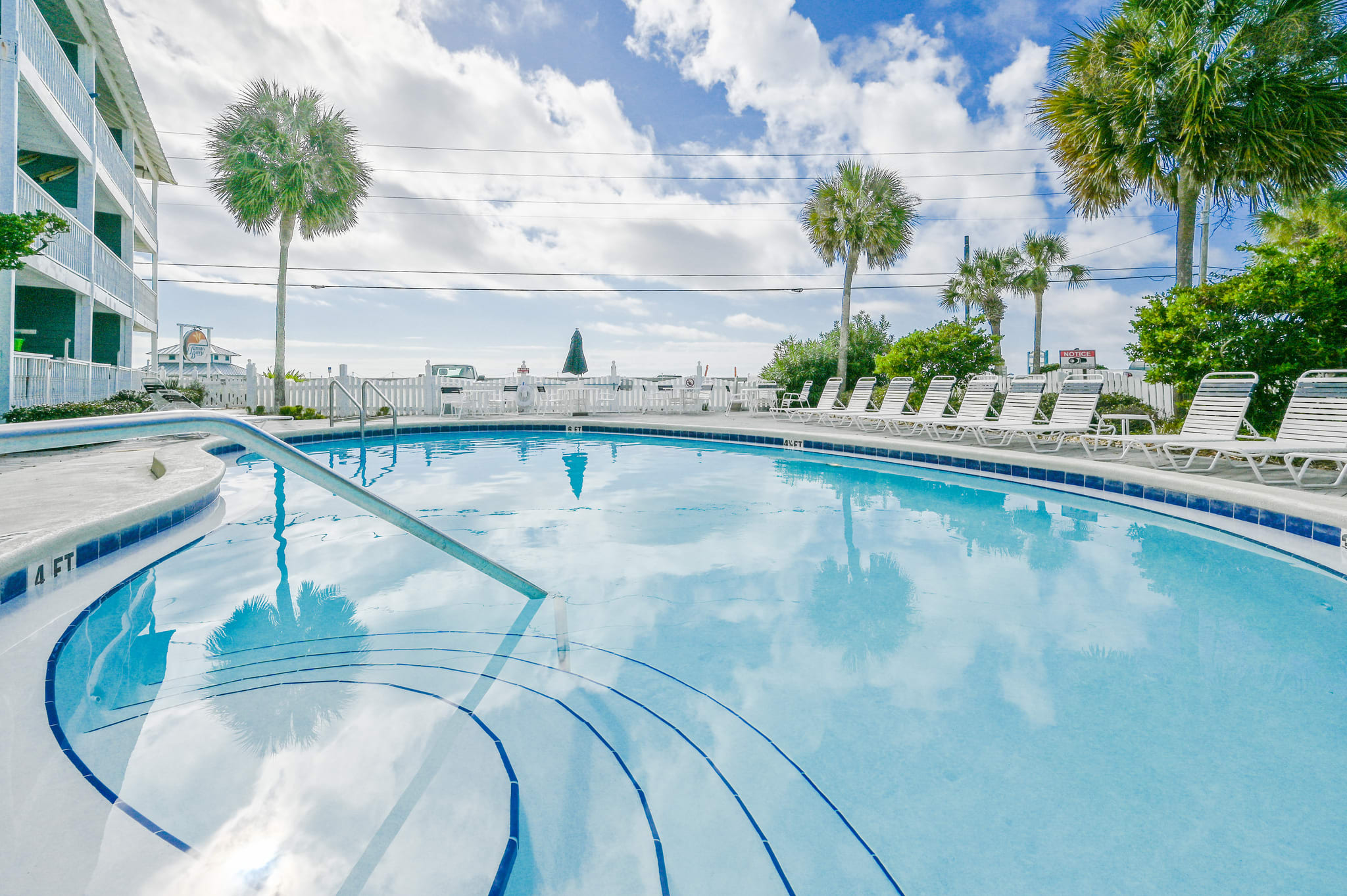 This idyllic pool situated directly across the street from the Gulf of Mexico. The location offers panoramic sunset views, while the warm breezes from the nearby ocean add to the natural beauty and serenity of this wonderful place