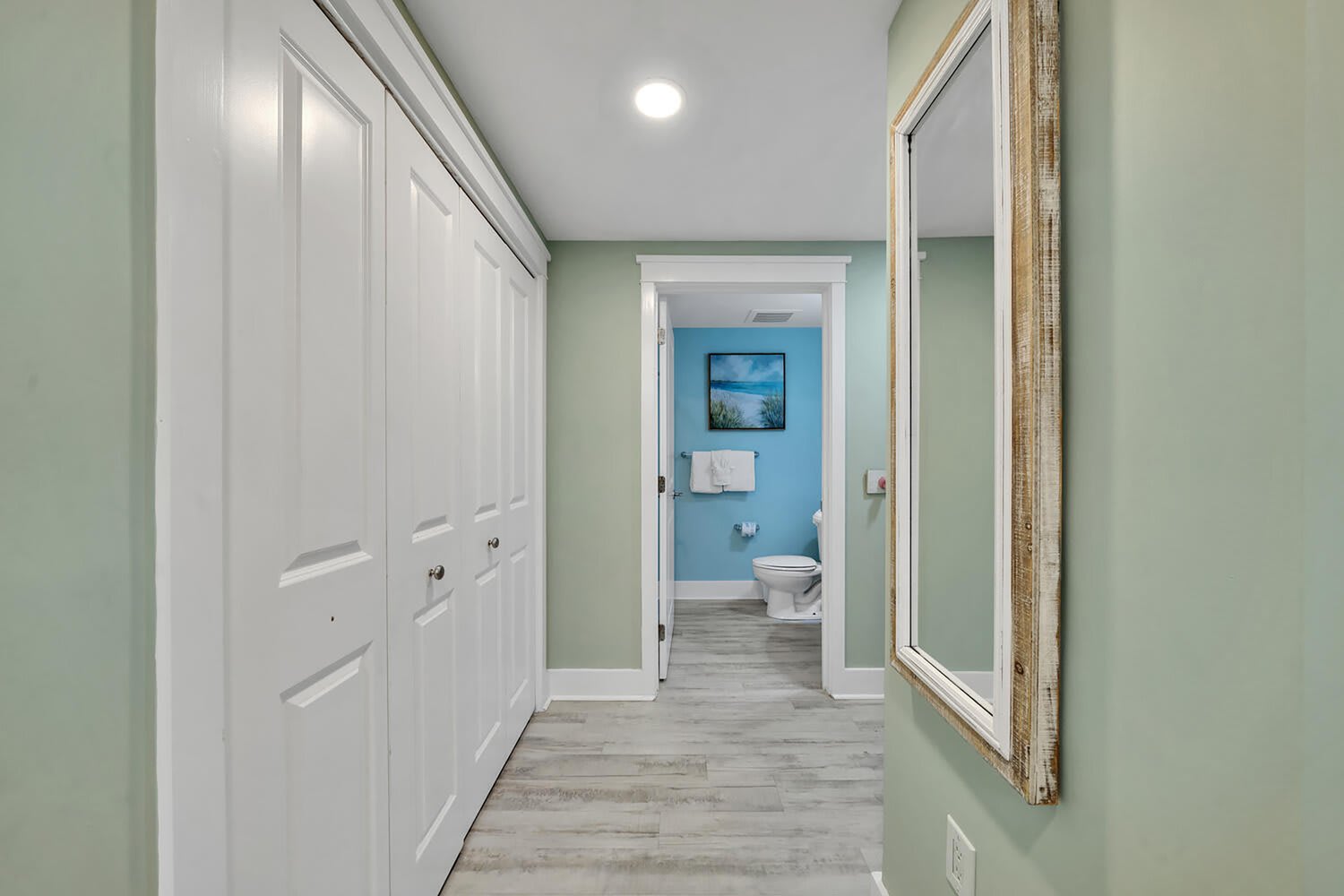 Hallway leading to second bathroom