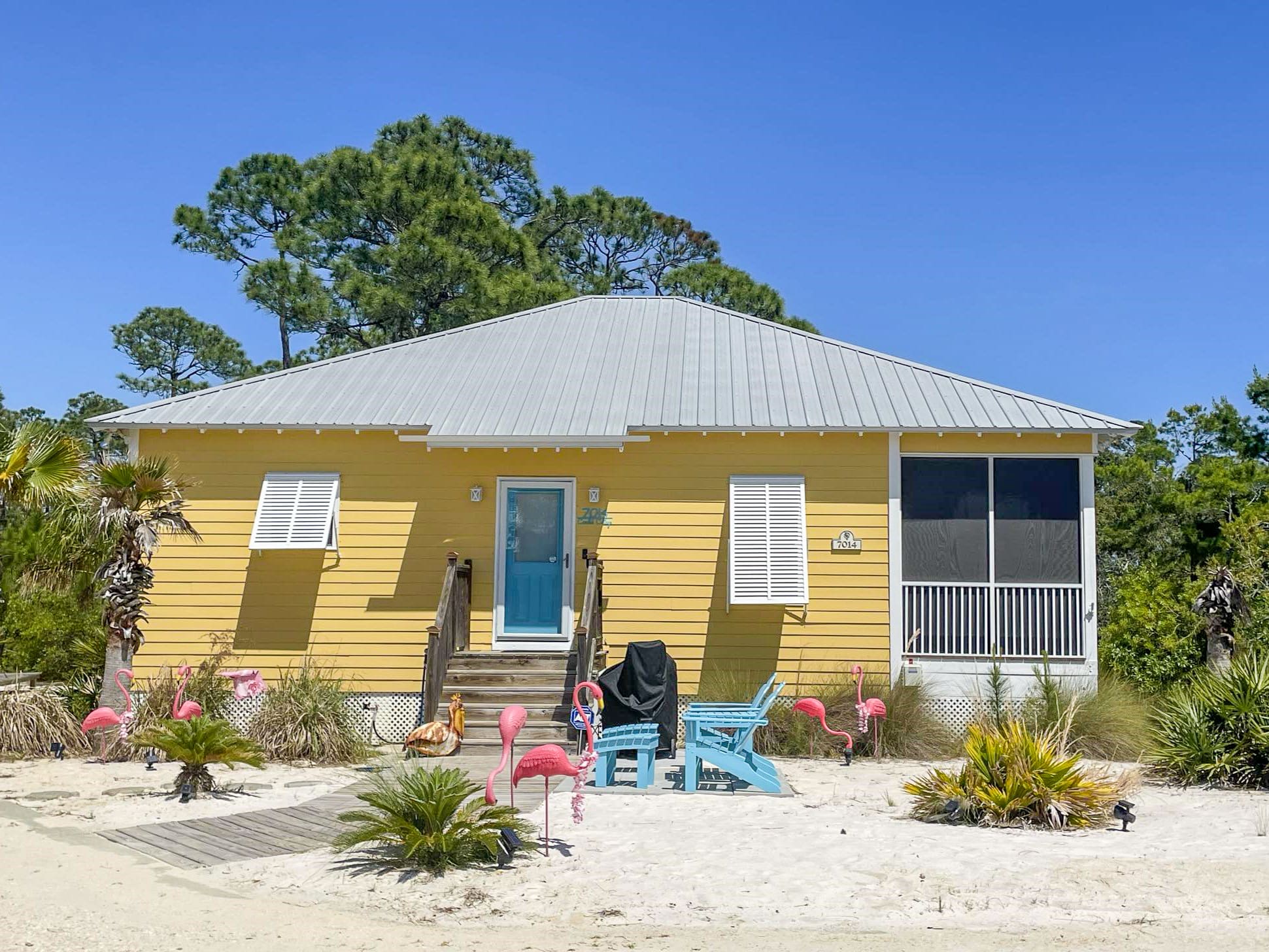 Front of Cottage, parking to the Left of wood sidewalk