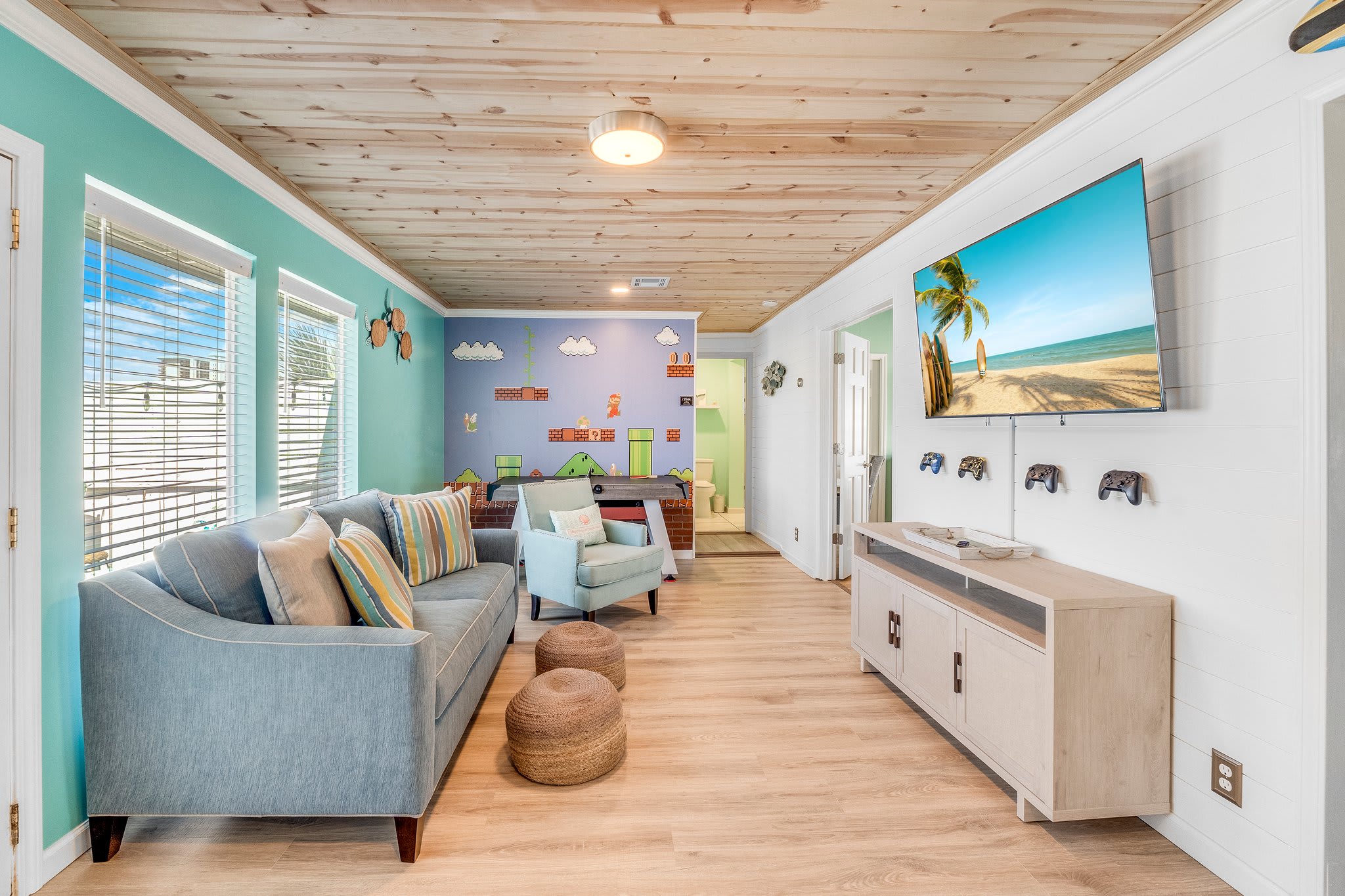 The Game Room is located on the second level  and includes Teenage Mutant Ninja Turtles arcade game, Marvel pinball machine, air hockey/ping pong table, mini fridge, and game stick with countl