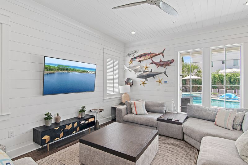 Spacious lounge with coastal accents and sunlit interiors.