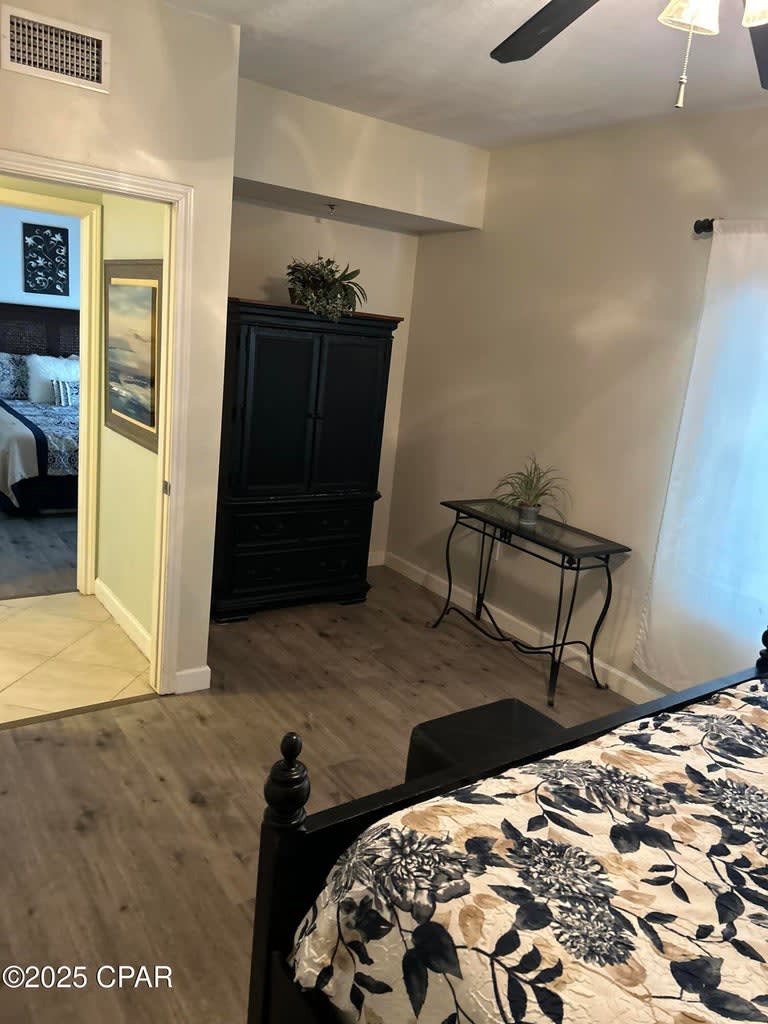 Cabinet houses a flat screen tv and space for clothing. 