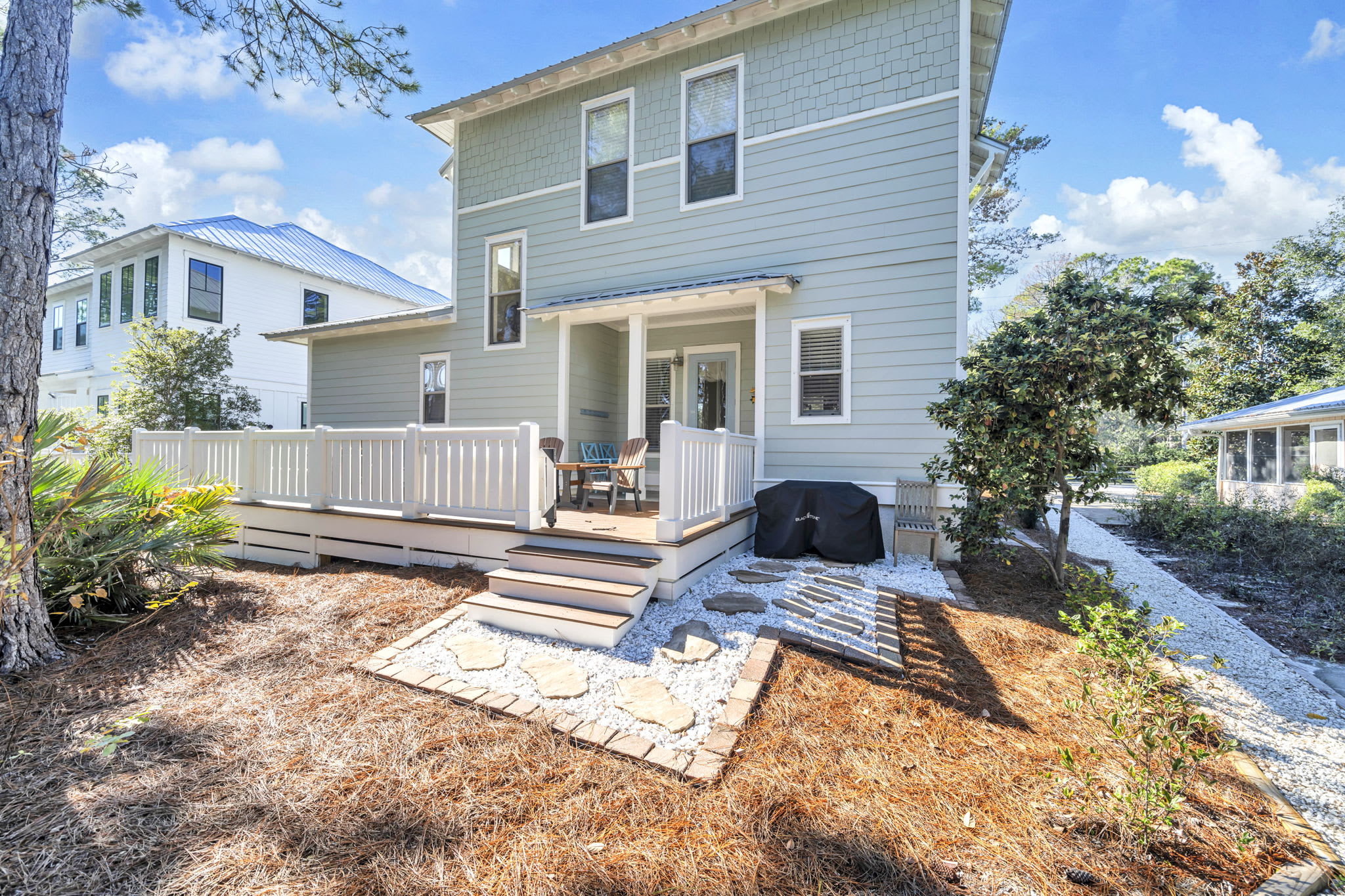 View from back of the house with new deck and blackstone grill.
