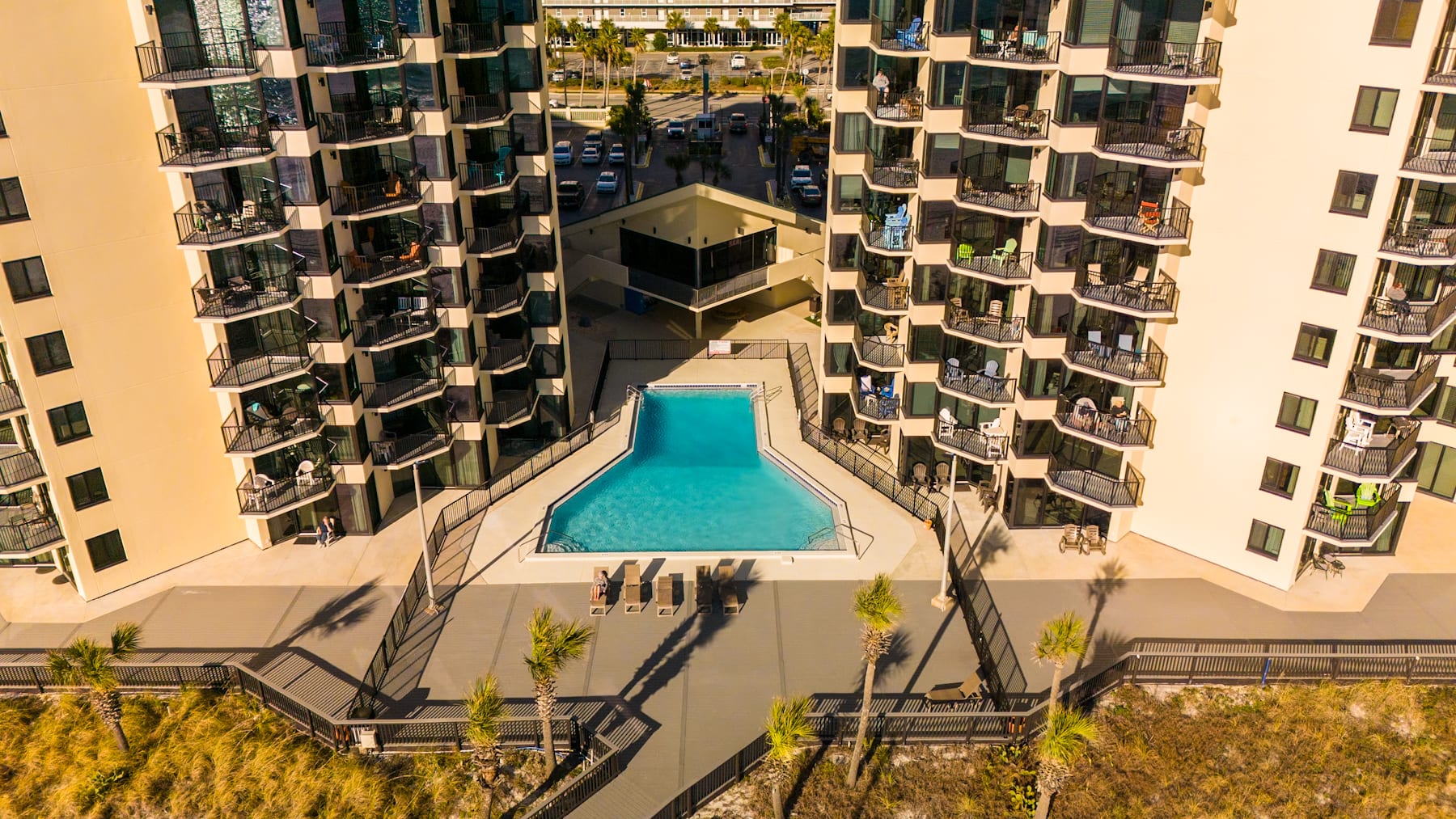Sunbird's main pool w/private gated beach access — no streets to cross, just sand between your toes.