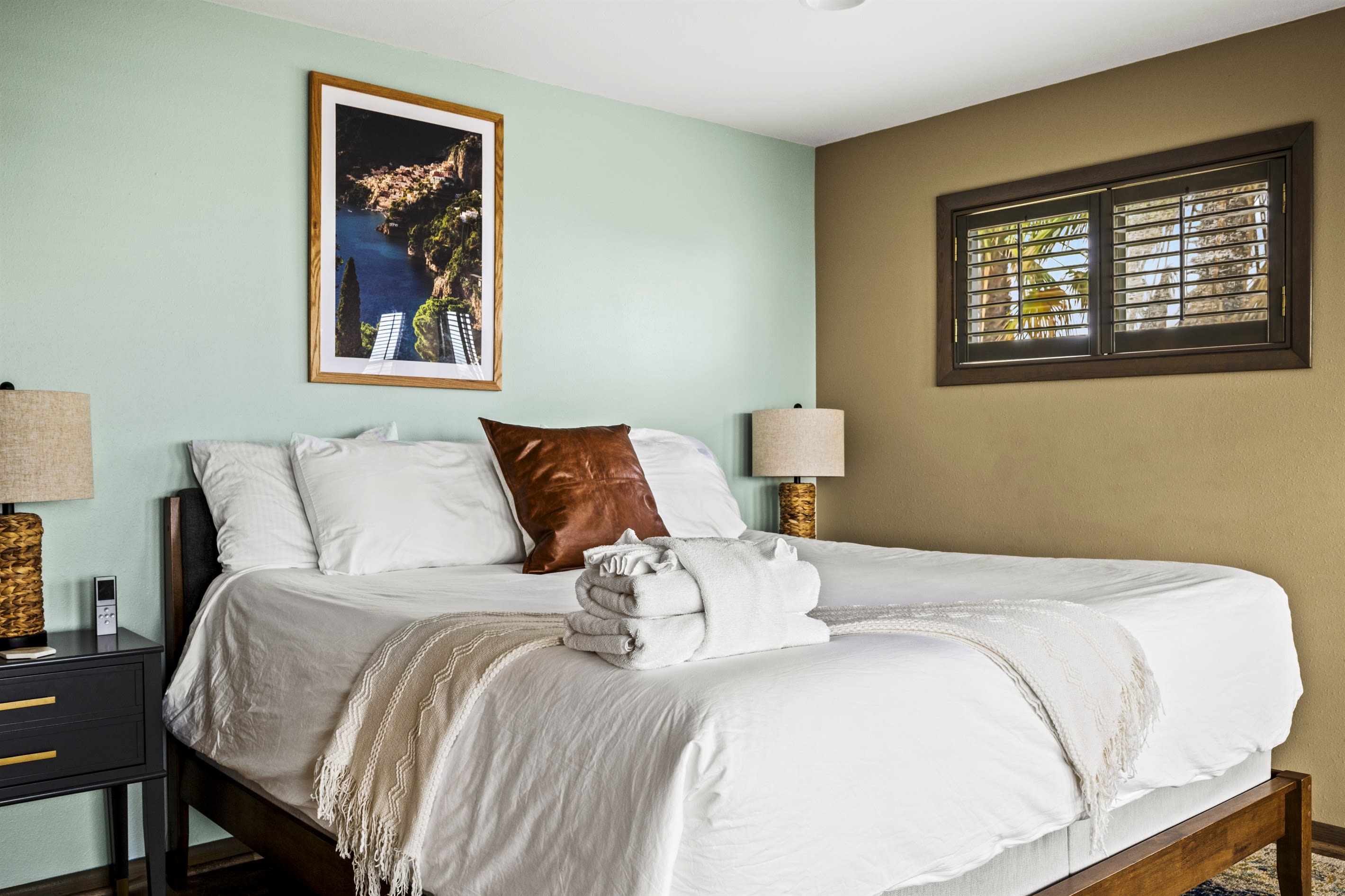 Tropical chic Master bedroom equipped with a comfortable king-size bed and access to a tranquil private veranda.