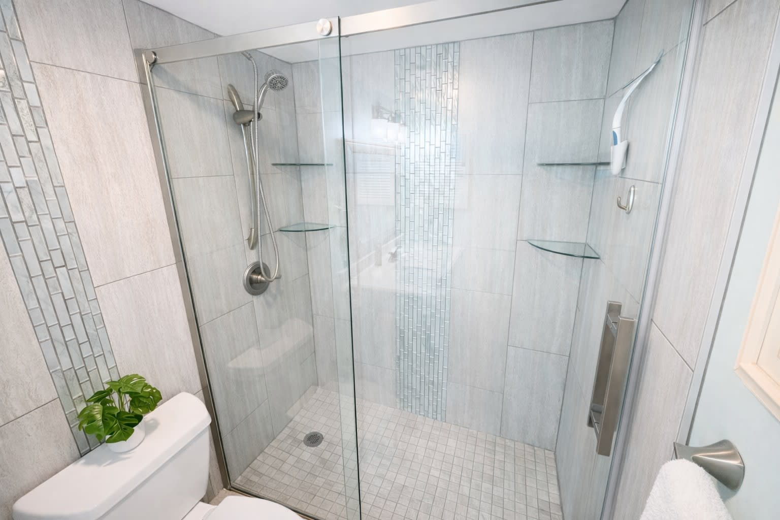 Airy walk-in shower designed for a fresh, spa-like feel.
