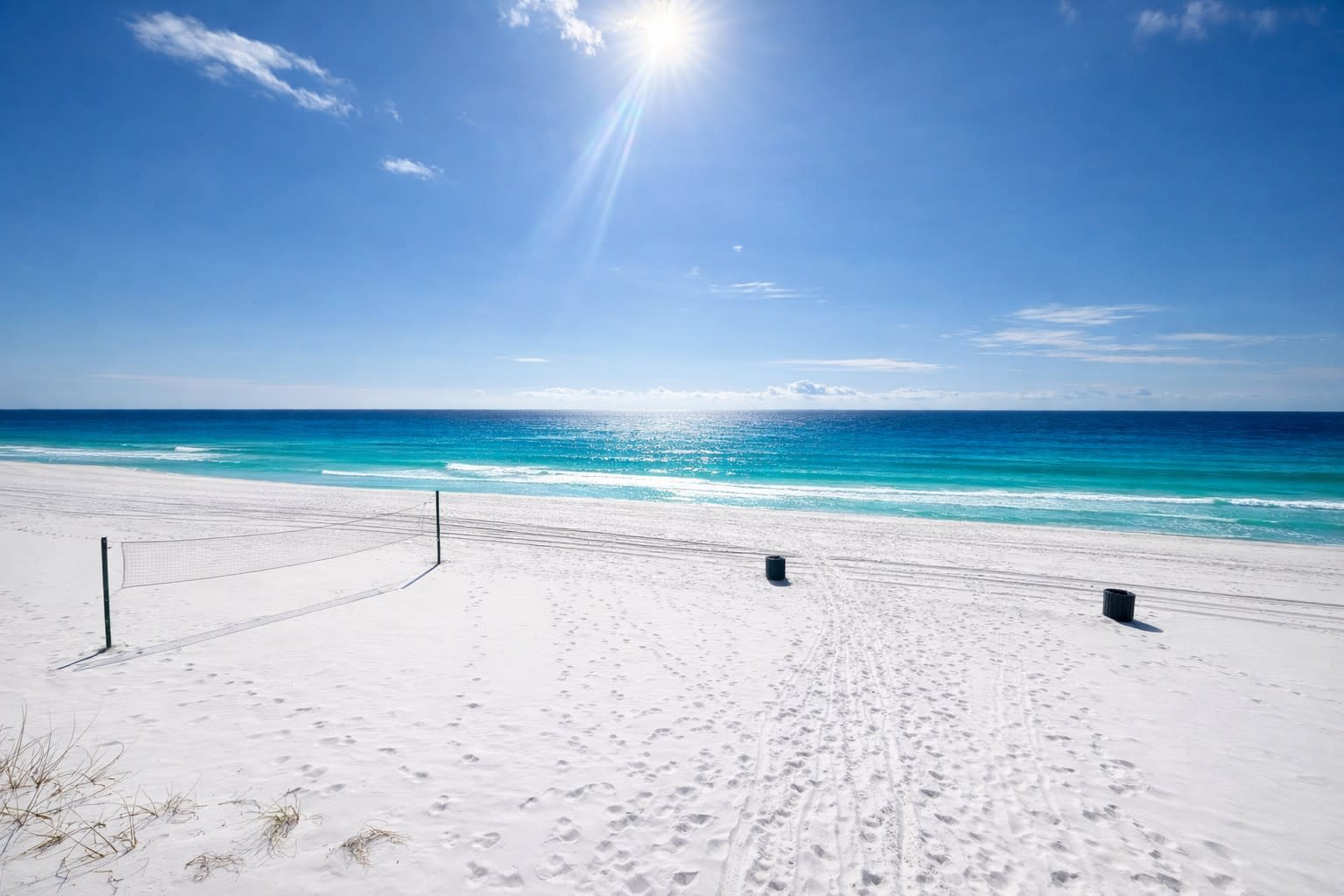 Beautiful white sandy beach with easy access from pool area.