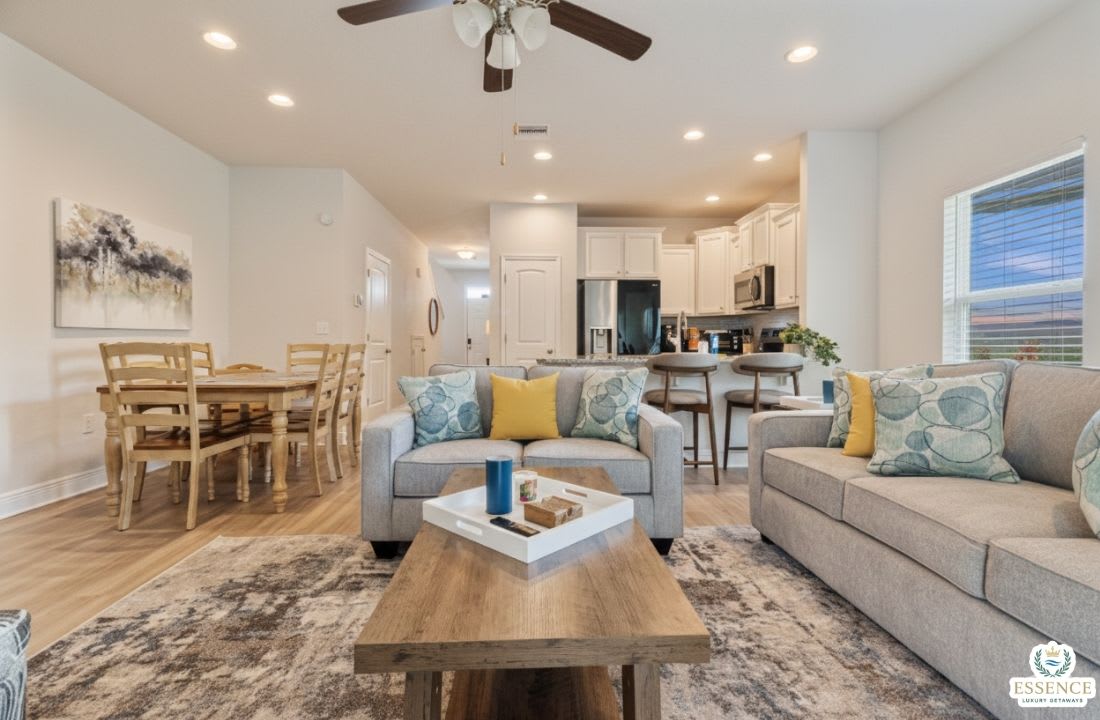 Bright, modern open-concept home with a cozy living area, stylish furnishings, and fully equipped kitchen. Enjoy comfortable seating, dining space, and natural light perfect for relaxing, working remotely, or hosting a memorable stay.