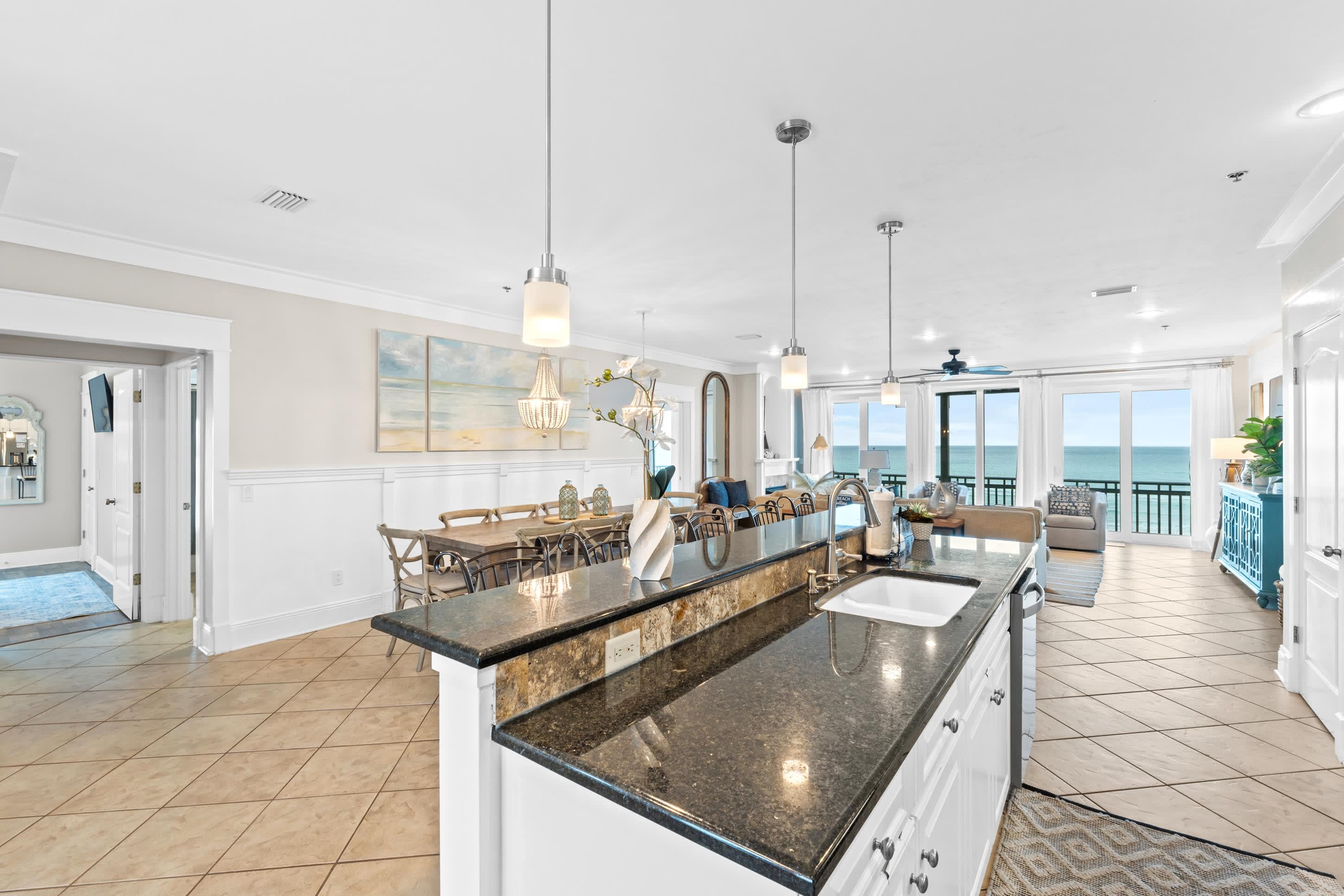 Entertain in style in this open-concept kitchen and living space, designed with modern touches and sweeping Gulf views. Whether cooking, relaxing, or hosting, this space keeps everyone connected.