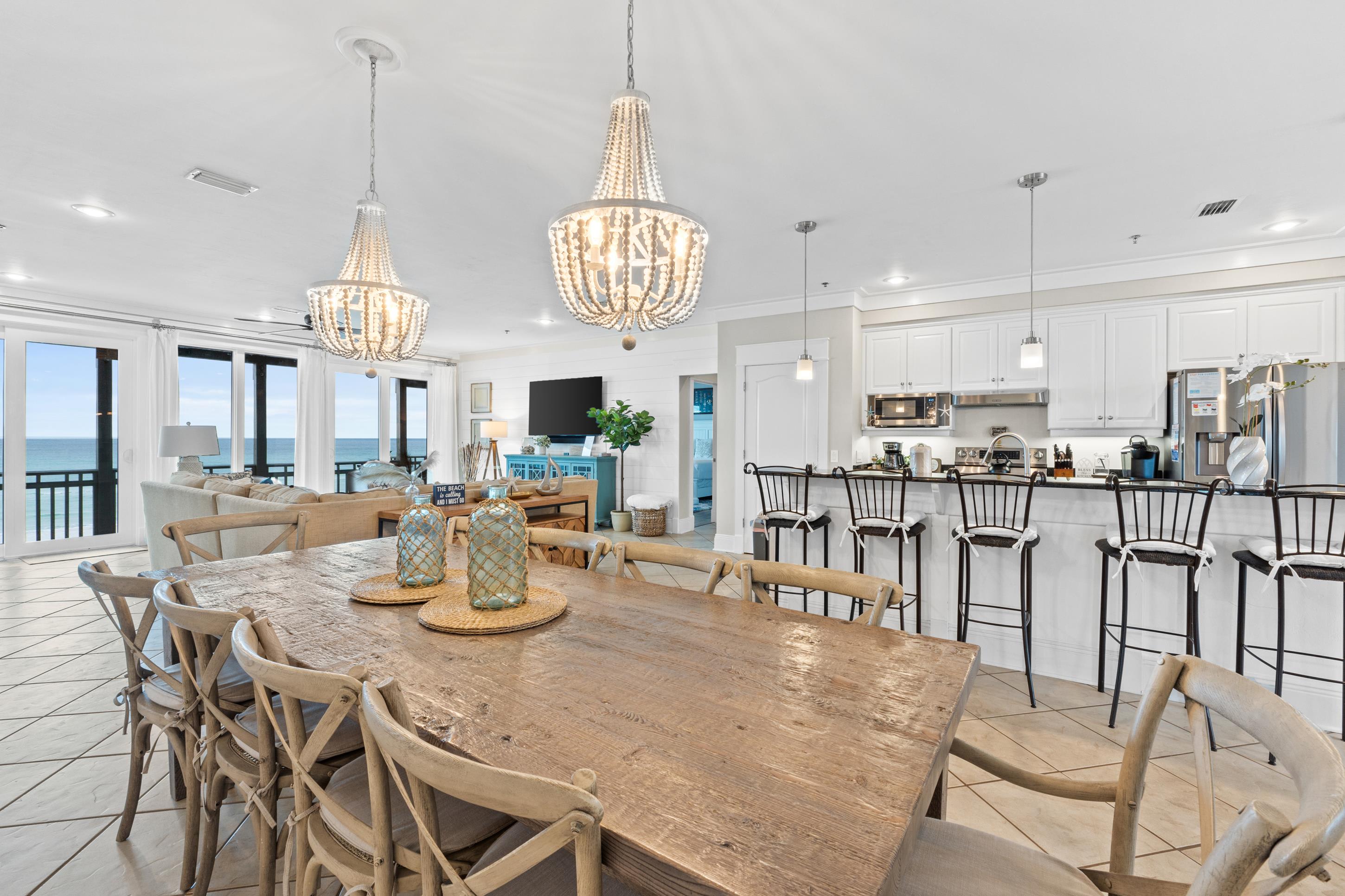 Host family dinners or celebrations around the oversized dining table with room for 10+. Enjoy open-concept living, designer lighting, and Gulf views that set the perfect backdrop for every gathering.