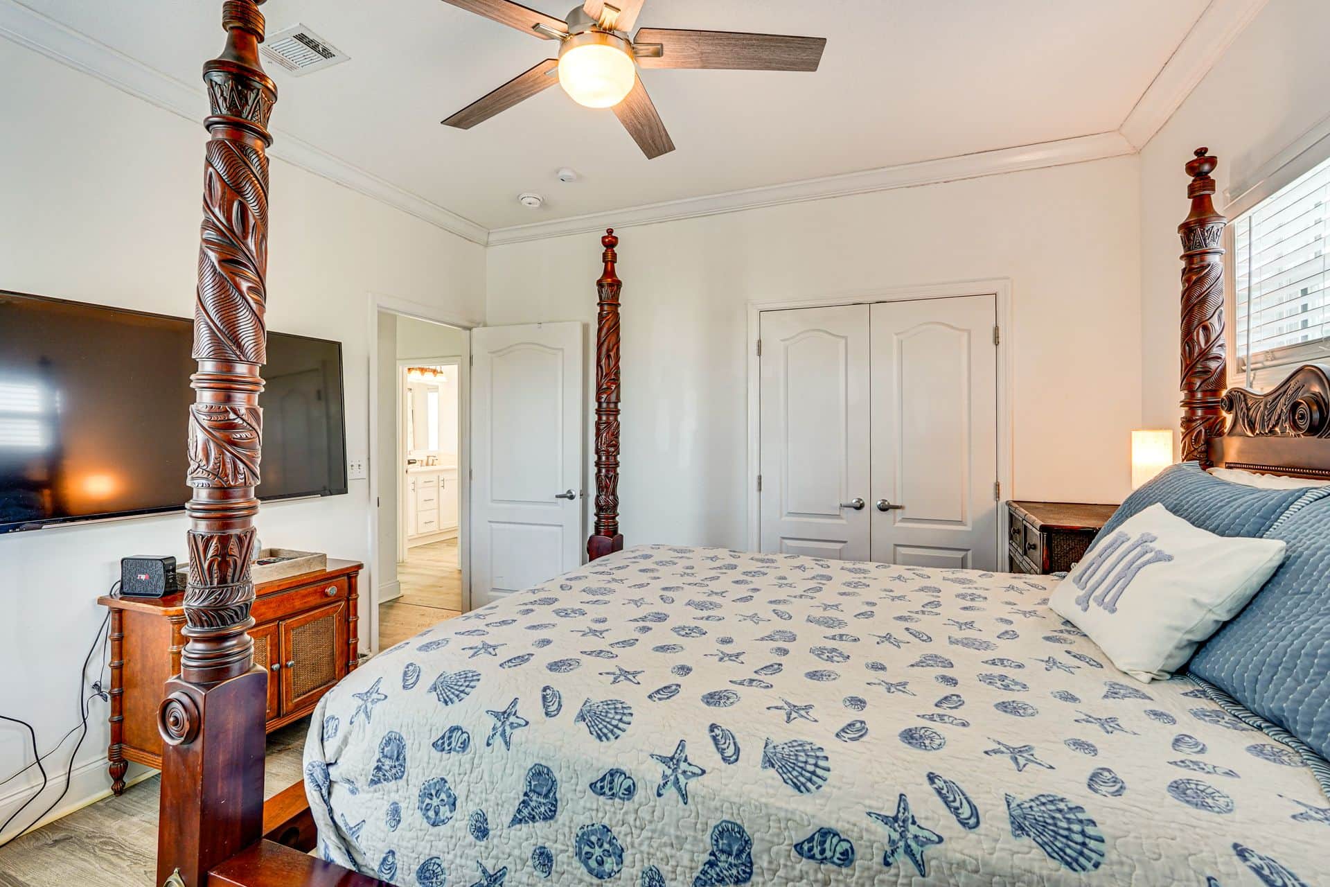 Four Post Bed with fan and TV.
