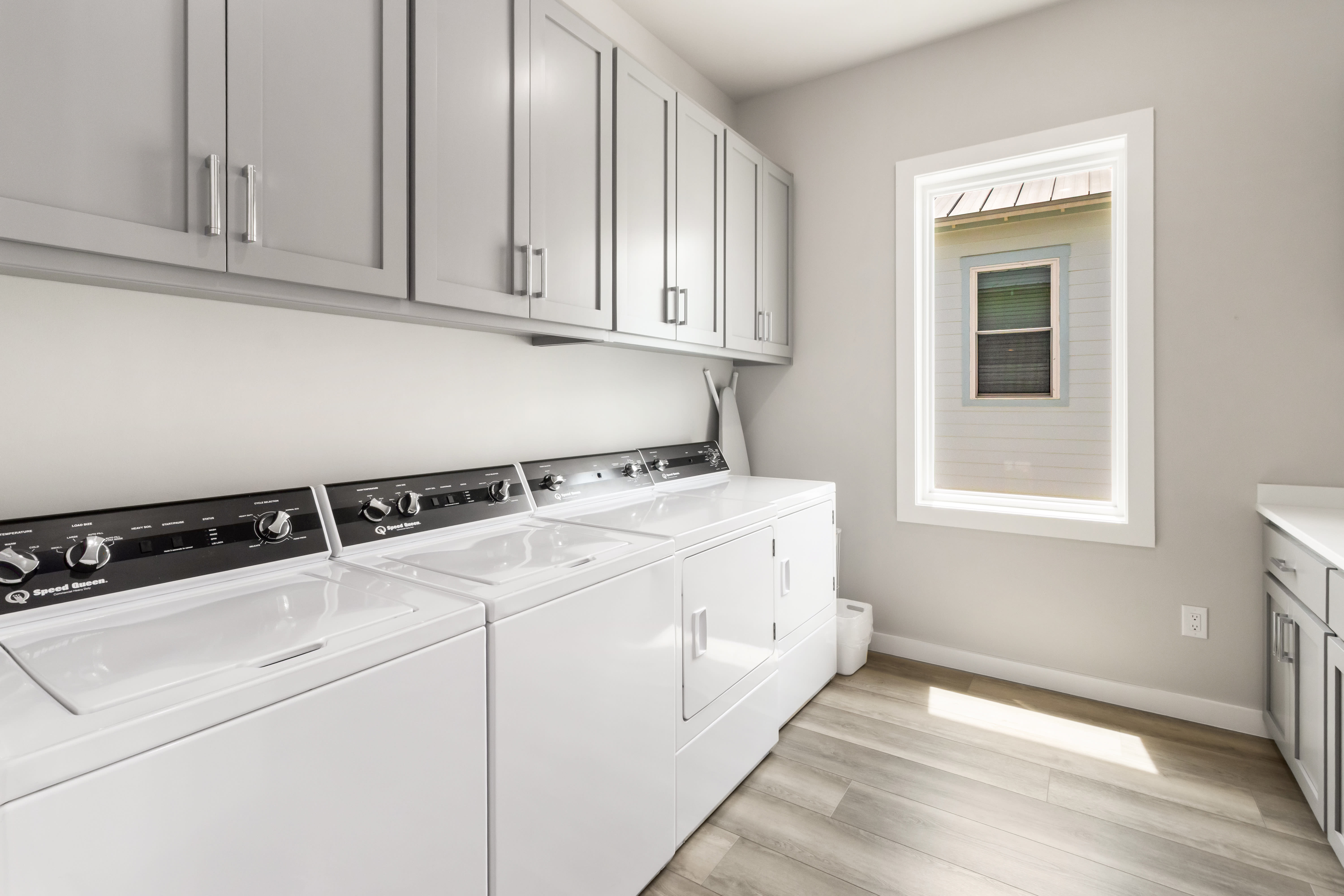 3rd Level Laundry Room with 2 Washers and 2 Dryers + Folding Counter