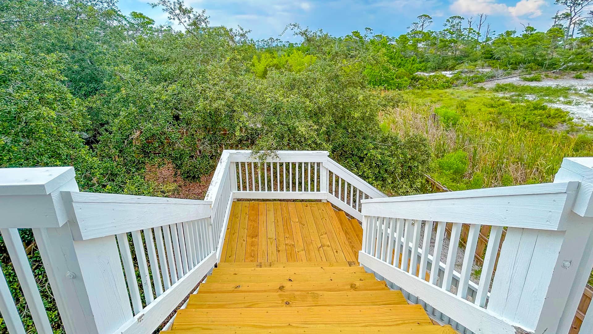 Back Deck Staircase leading to fenced area