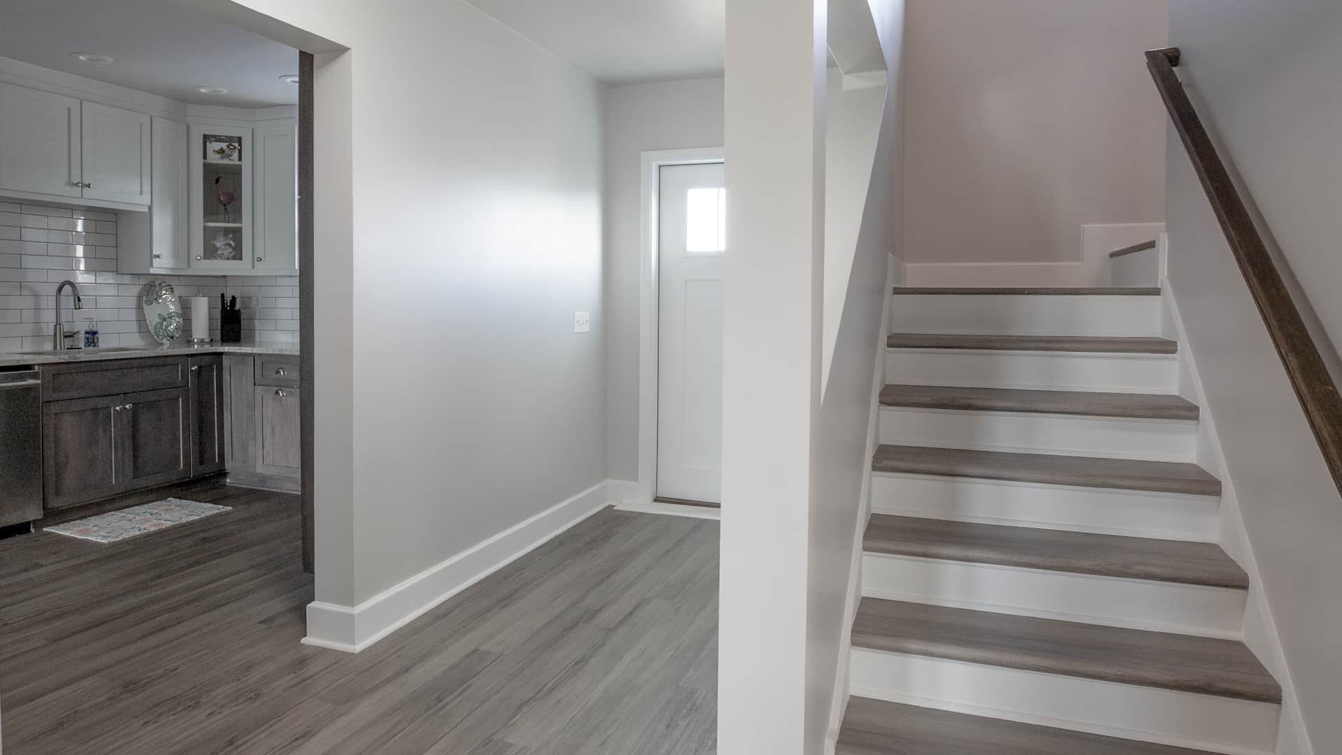 Entryway and staircase leading to 2nd Floor