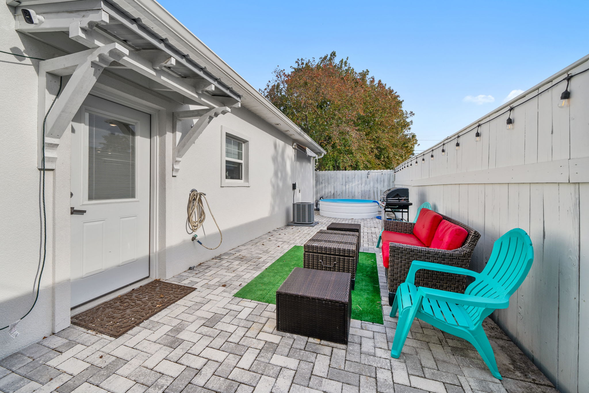 Outdoor space with Grill, pool, outdoor furniture, outdoor shower