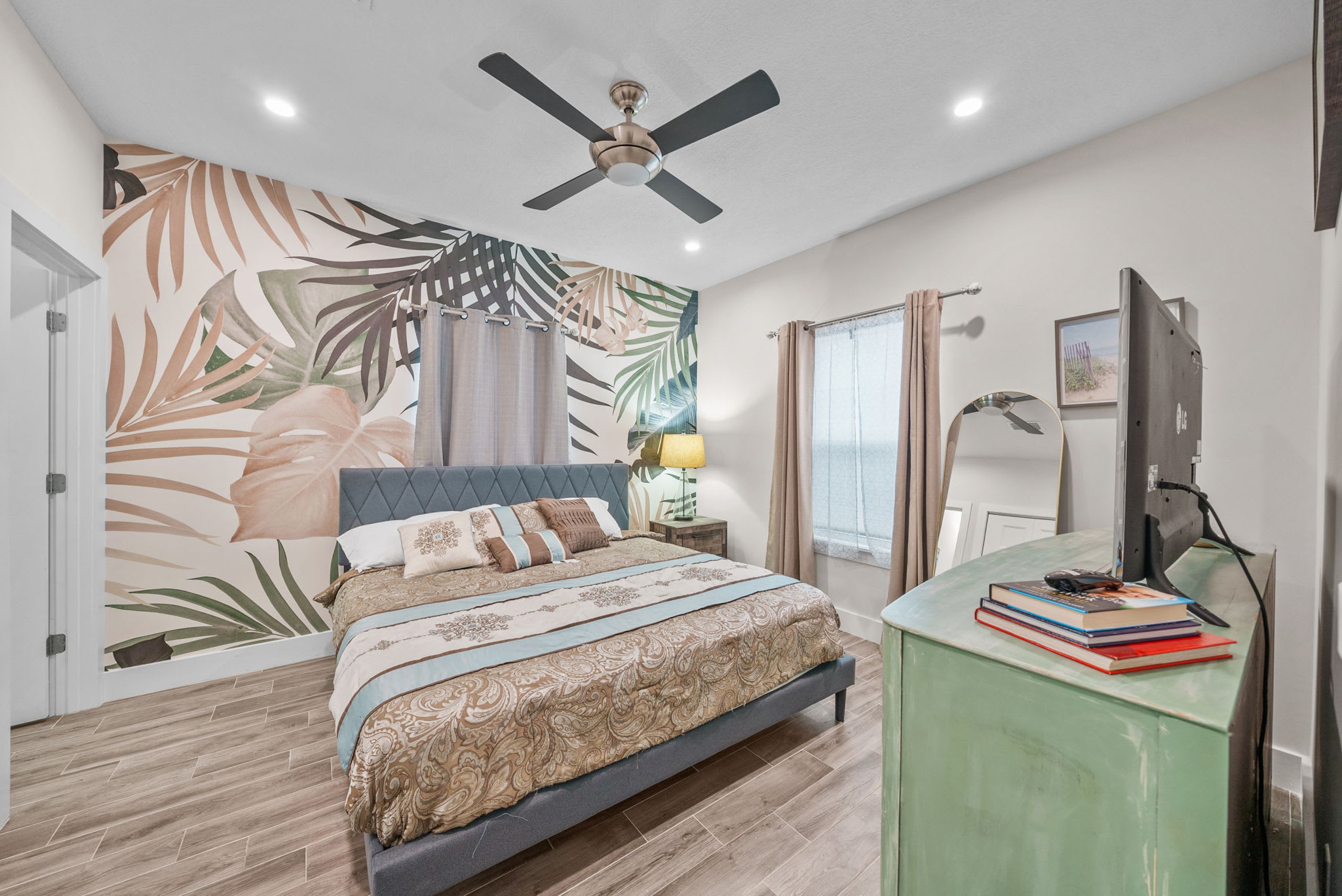 Beautifully designed Master bedroom with King suite, Smart TV, full length mirror, attached full bath room with biden, books, beach towels.