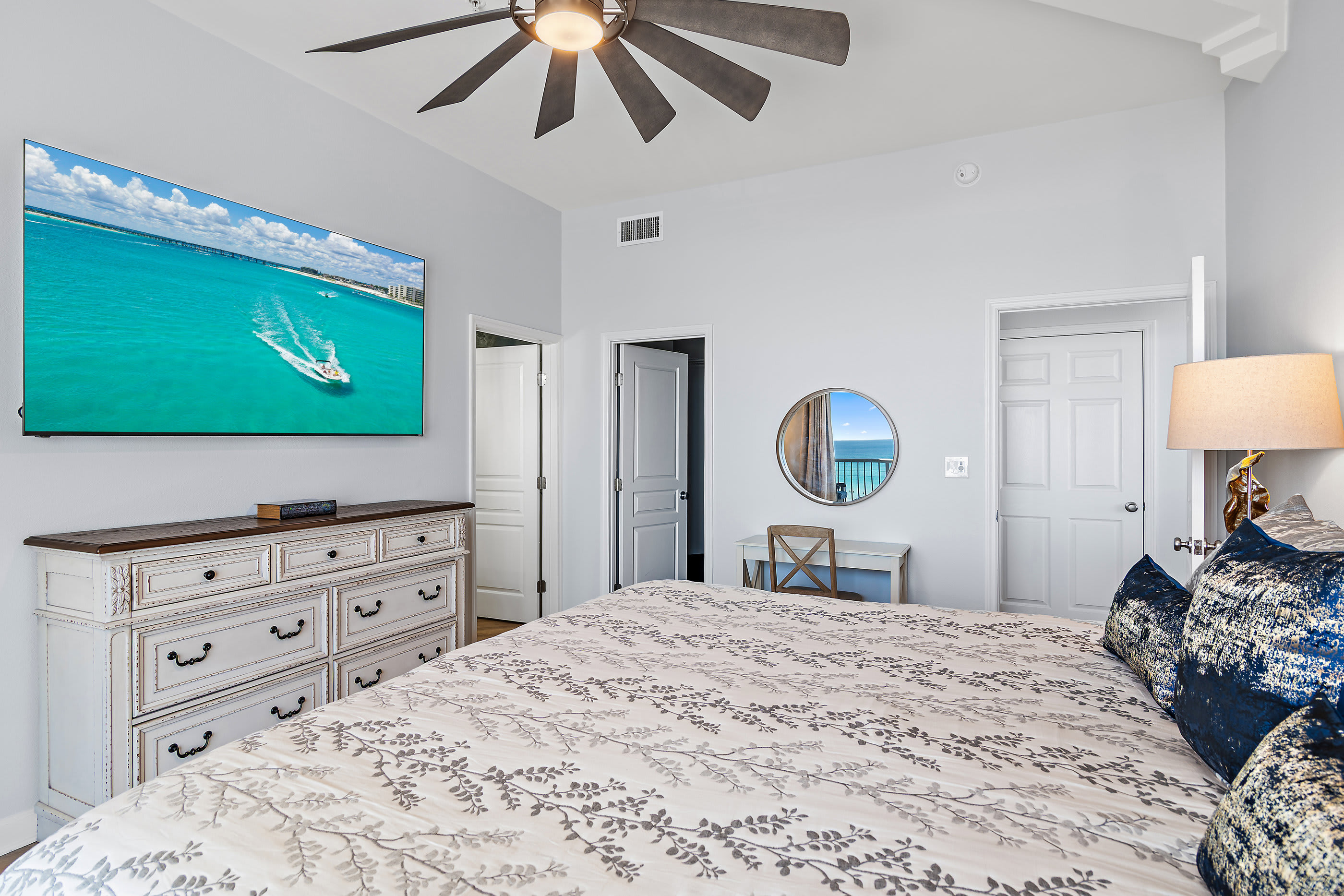 Master bedroom alternate view with dresser and TV